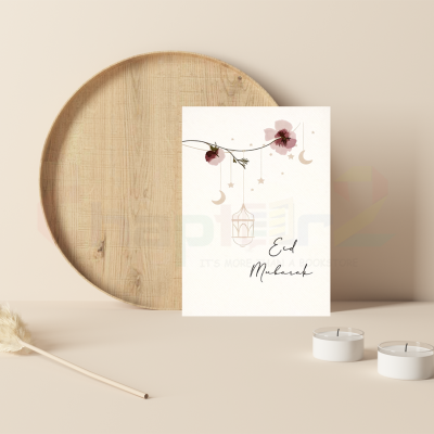 hanging lanterns and floral branch eid mubarak greeting card featuring crescent moon and stars