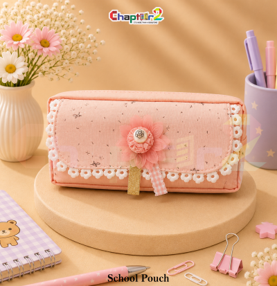 pencil pouch with floral lace trim and flower accent shown upright on a display podium with cute stationery items surrounding it