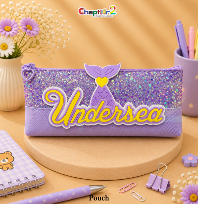 pencil pouch featuring mermaid tail and Undersea text shown upright on a display podium with cute stationery items surrounding it