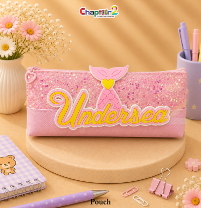pencil pouch featuring mermaid tail and Undersea text shown upright on a display podium with cute stationery items surrounding it