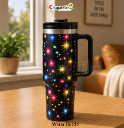 water bottle featuring colorful fireworks black design shown upright on a wooden table with a cozy background