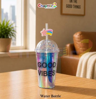 water bottle featuring good vibes holographic and shooting star design shown upright on a wooden table with a cozy background