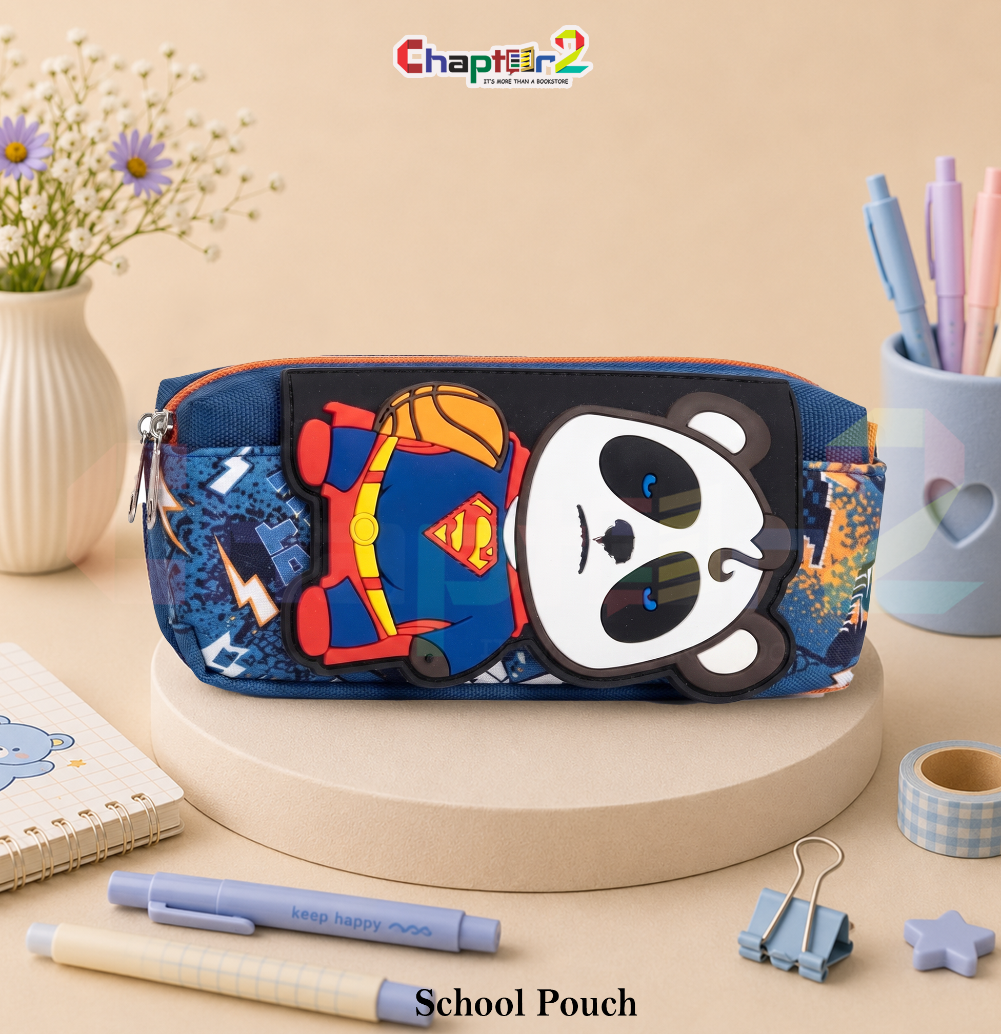 51065706 (2a) pencil pouch featuring superhero panda holding a basketball shown upright on a display podium with cute stationery items surrounding it