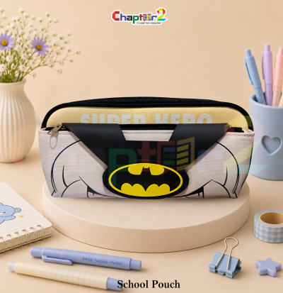 pencil pouch featuring superhero bat mask and logo shown upright on a display podium with cute stationery items surrounding it
