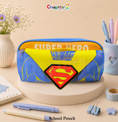 pencil pouch featuring superhero shield emblem and yellow cape shown upright on a display podium with cute stationery items surrounding it