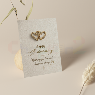 anniversary card featuring interlocking gold wire hearts and gold foil typography