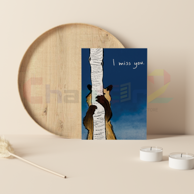 cute illustrated brown bear hugging birch tree trunk i miss you greeting card on blue