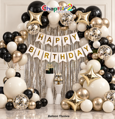 Birthday balloon garland arch kit with four-point starburst foil balloons and white pennant banner